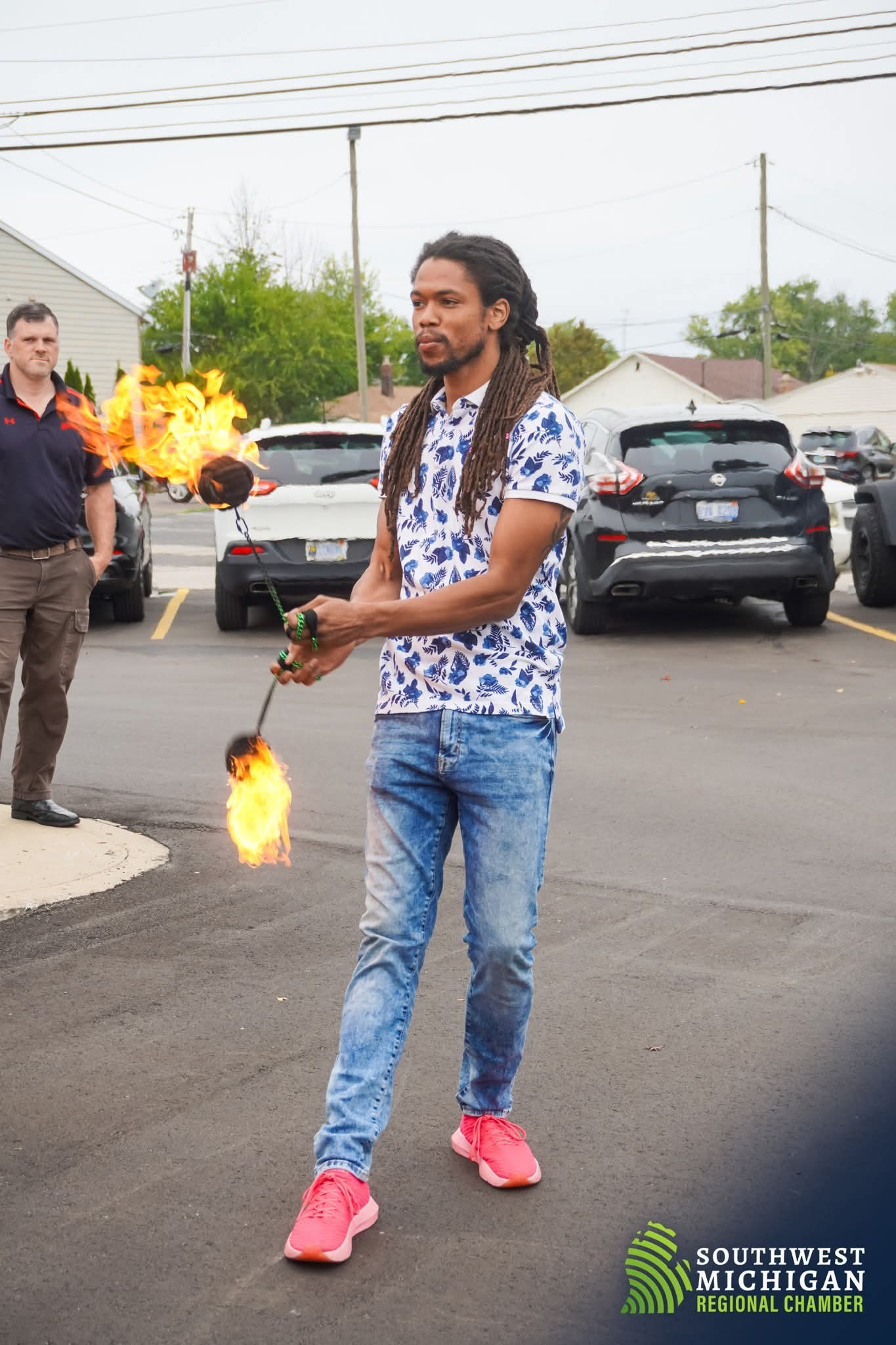 Nick May fire poi performance at Southwest Michigan Regional Chamber event