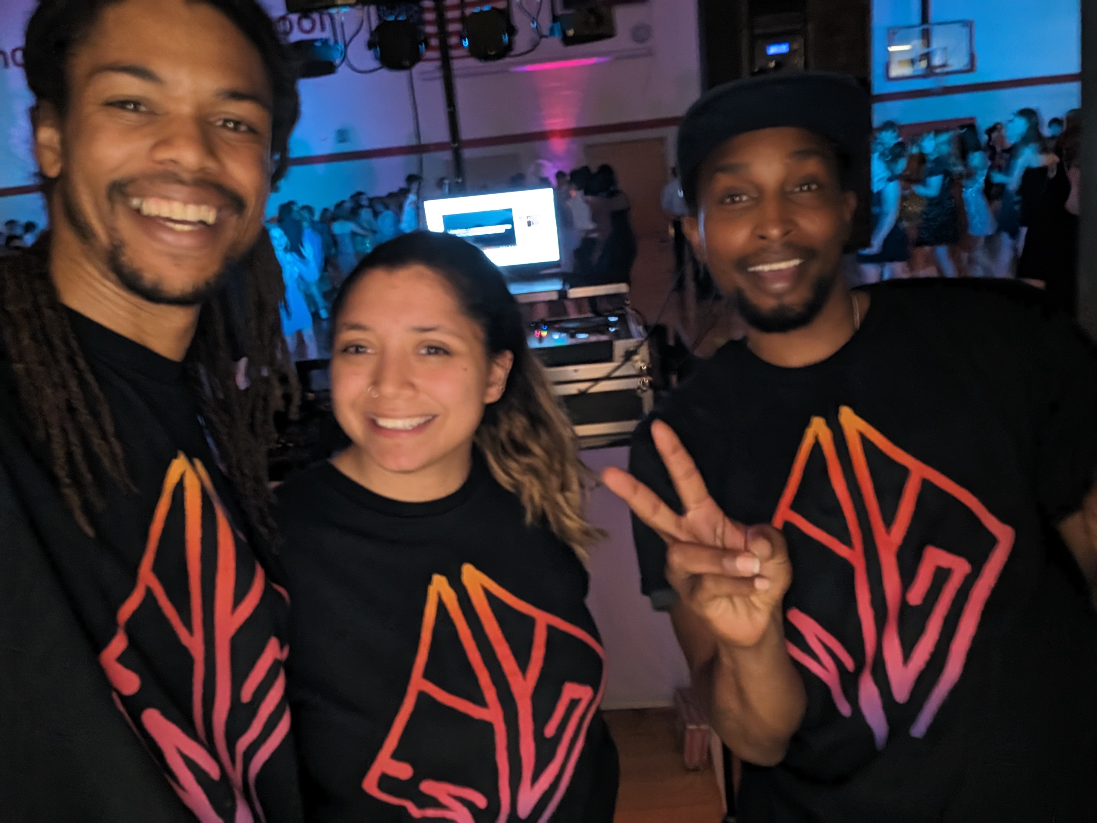 Nick May and team in LuxWave shirts at event